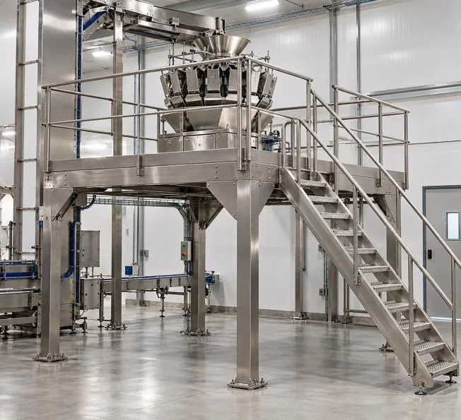 Multihead weigher and packaging machine arranged within a stainless-steel mezzanine